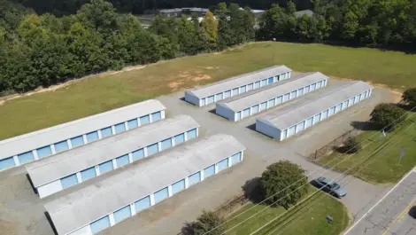 Drone view showing rows of outdoor storage units and access lanes.