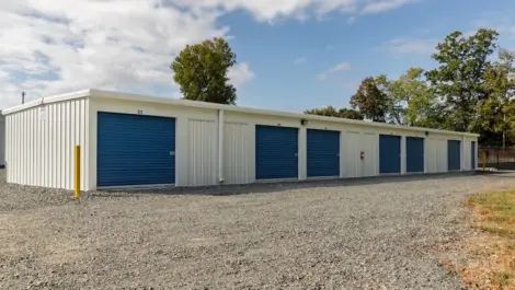 Outdoor view of multiple storage units with roll-up doors.